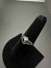 10k white gold ring w trillion cut blue sapphire stones