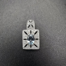 10k white gold pendant w diamonds & aquama rine stone