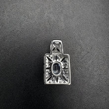 10k white gold pendant w diamonds & aquama rine stone