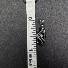 10k white gold pendant w black onyx stone & diamond