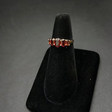 14k gold ring w garnet stones (3.2)