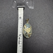 14k gold rose pendant set on jade stone