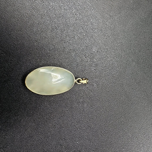 14k gold rose pendant set on jade stone