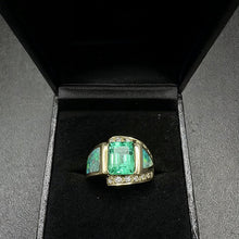 14k yellow gold ring centered w 1 emerald cut emerald, & fire opals w diamonds