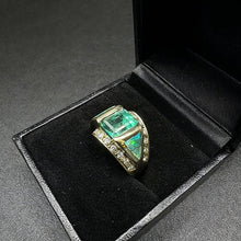 14k yellow gold ring centered w 1 emerald cut emerald, & fire opals w diamonds
