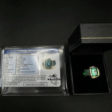 14k yellow gold ring centered w 1 emerald cut emerald, & fire opals w diamonds