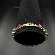14K yellow gold flower bracelet w precious stones